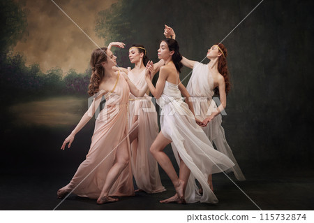 Ballerina Dream. Dancers in flowing gowns posing gracefully against vintage studio background. Ballerina Dream. Dancers in flowing gowns posing gracefully against vintage studio background. 115732874