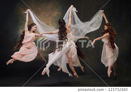 Group of young beautiful ballerinas gracefully moves in dance, as muses against vintage studio background. 115732885
