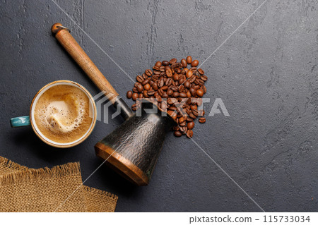 Roasted coffee beans and espresso coffee cup Roasted coffee beans and espresso coffee cup 115733034