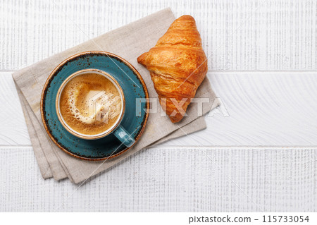 Cappuccino coffee and fresh croissant Cappuccino coffee and fresh croissant 115733054