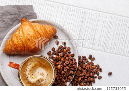 Cappuccino coffee and fresh croissant Cappuccino coffee and fresh croissant 115733055