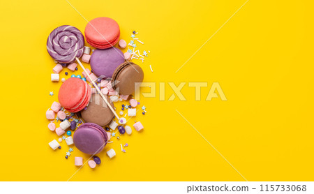 Various colorful candies, lollipops, and macaroons Various colorful candies, lollipops, and macaroons 115733068