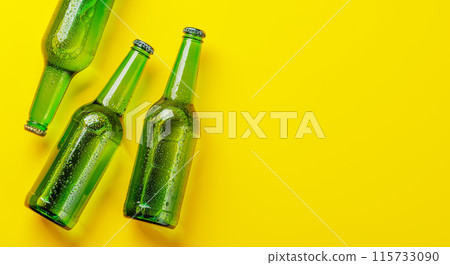 Beer bottles on yellow background Beer bottles on yellow background 115733090
