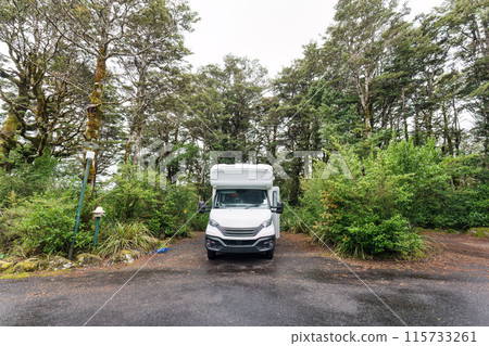 Motorhome parked to charge battery on the campground 115733261