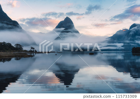 Milford Sound with Mitre peak and foggy on the lake at Fjordland national park, New Zealand 115733309