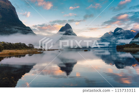 Milford Sound with Mitre peak and foggy on the lake at Fjordland national park, New Zealand 115733311