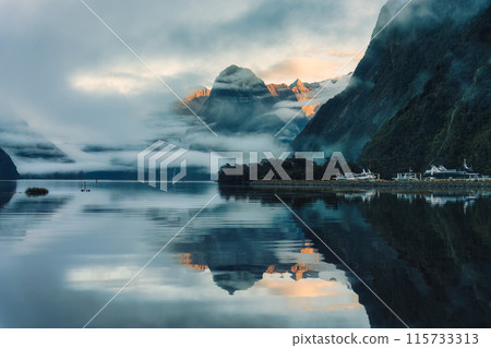 Milford Sound with waterfall in foggy on the lake at Fjordland national park, New Zealand 115733313
