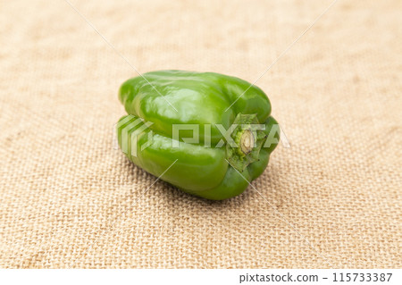 Bell peppers in a burlap sack Bell peppers in a burlap sack 115733387
