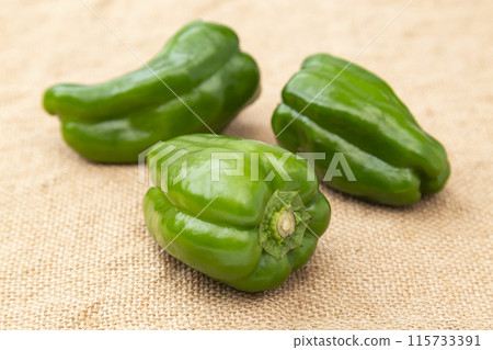 Bell peppers in a burlap sack 115733391