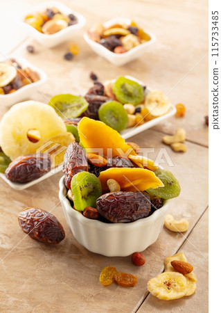 Dried tropical fruits with various nuts and raisins. 115733485