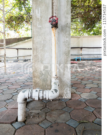 The metal pipe with the control valve. 115734587