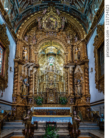 The intricate golden interior of the Carmelite church Igreja do Carmo in the old town of Faro in Portugal 115734825