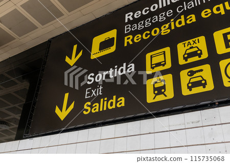 Exit, car rental, bus, train and taxi sign at international airport. Follow the yellow sign at airport 115735068