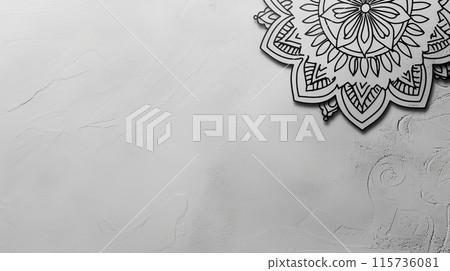 A sleek, light grey background with a simple, yet sophisticated, black mandala 115736081