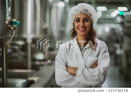 Confident Female Scientist in Food Production Facility Confident Female Scientist in Food Production Facility 115736159