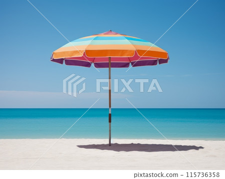 A colorful beach umbrella stands alone on a pristine sandy beach, with the turquoise sea and clear blue sky in the background. 115736358