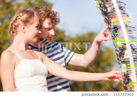 young couple buying new sunglasses outdoor young couple buying new sunglasses outdoor 115737303