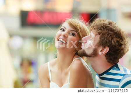 Couple of tourists taking walk in city street 115737325