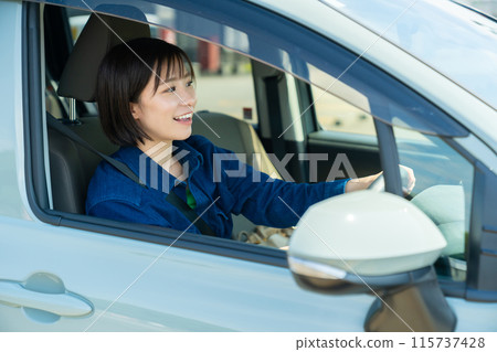 Woman in a car, woman driving a car, woman driving 115737428