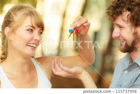 Couple showing their new house keys 115737956