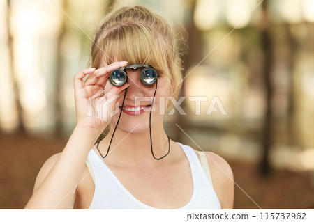 tourist woman looking through binoculars n city tourist woman looking through binoculars n city 115737962