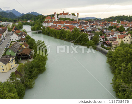 Fussen, Bavaria, Germany. Aerial view over the medieval town at sunset time. Historical Palace, Hohes Schloss. 115738476