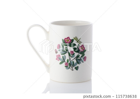 cup with a flower painted on it on a white background. Isolate 2 115738638