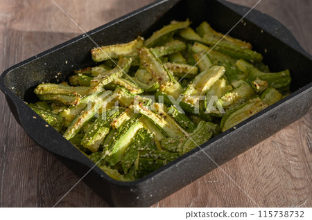 zucchini baked in the oven on a wooden table 1 zucchini baked in the oven on a wooden table 1 115738732