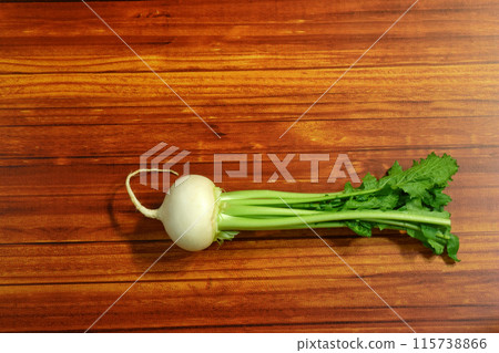 Turnips on a wooden board 115738866
