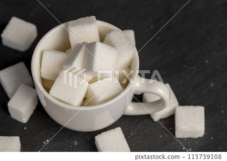 white square sugar on a black background 115739108