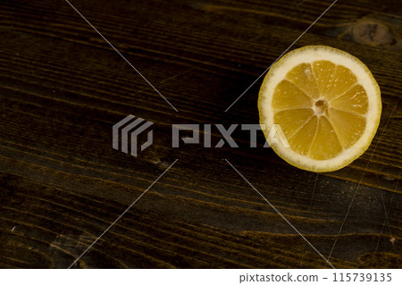 ripe sliced lemon on a board ripe sliced lemon on a board 115739135