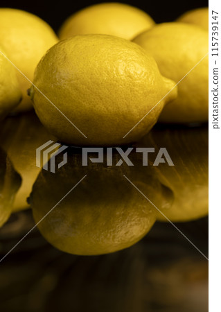 ripe lemon on a black background 115739147