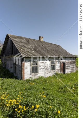 a rotting one-story house in an abandoned village a rotting one-story house in an abandoned village 115739249