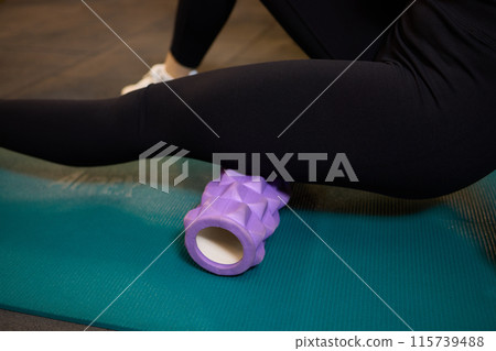 Leg massage with foam roller helps relax muscles, recover, relieve tightness, and prevent injuries Leg massage with foam roller helps relax muscles, recover, relieve tightness, and prevent injuries 115739488