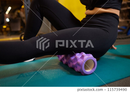 Leg massage with foam roller helps relax muscles, recover, relieve tightness, and prevent injuries Leg massage with foam roller helps relax muscles, recover, relieve tightness, and prevent injuries 115739490