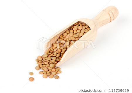 Pile of brown raw dry lentils in wooden ladle isolated on white background 115739639