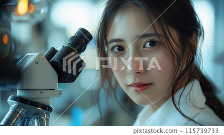 Female Asian Scientist Using Microscope In Research Lab Female Asian Scientist Using Microscope In Research Lab 115739733
