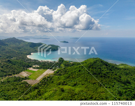 Tropical Island with farmland and white sand beach. Diapela Beach. El Nido, Palawan, Philippines. Tropical Island with farmland and white sand beach. Diapela Beach. El Nido, Palawan, Philippines. 115740013