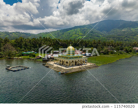 Linuk Masjid a mosque beside the Lake Lanao in Lanao del Sur. Blue sky and clouds. Mindanao, Philippines. Blue sky and clouds. Linuk Masjid a mosque beside the Lake Lanao in Lanao del Sur. Blue sky and clouds. Mindanao, Philippines. Blue sky and clouds. 115740020
