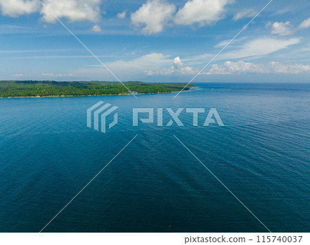 Aerial survey of tropical island and blue sea. Blue sky and clouds. Talikud Island. Samal, Davao. Philippines. Aerial survey of tropical island and blue sea. Blue sky and clouds. Talikud Island. Samal, Davao. Philippines. 115740037