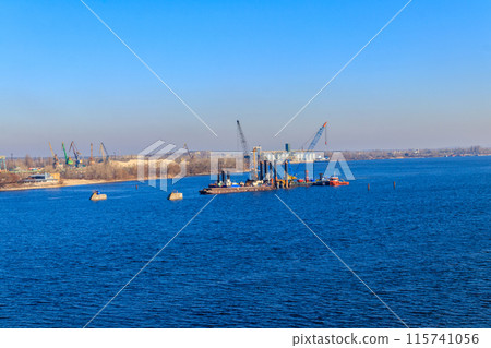 Construction of a new bridge across the Dnieper river in Kremenchug, Ukraine Construction of a new bridge across the Dnieper river in Kremenchug, Ukraine 115741056