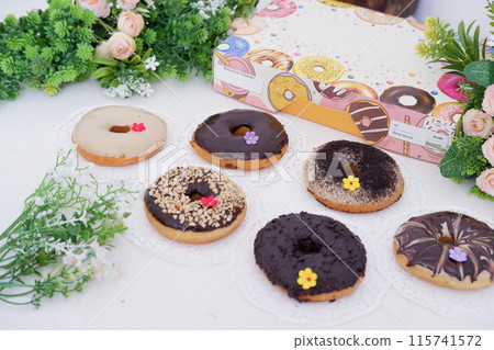 donuts with delicious topping as a background donuts with delicious topping as a background 115741572