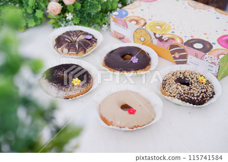 donuts with delicious topping as a background donuts with delicious topping as a background 115741584