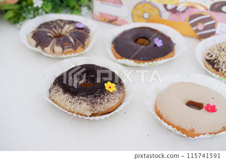 donuts with delicious topping as a background donuts with delicious topping as a background 115741591