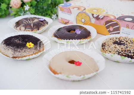 donuts with delicious topping as a background donuts with delicious topping as a background 115741592