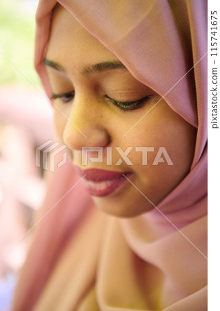 Close up Portrait of a Joyful Middle Eastern Hijabi Close up Portrait of a Joyful Middle Eastern Hijabi 115741675