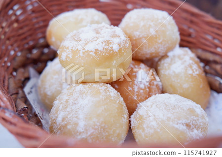 delicious snowball donuts as a background delicious snowball donuts as a background 115741927