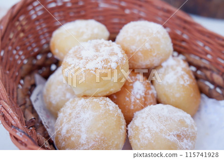 delicious snowball donuts as a background delicious snowball donuts as a background 115741928