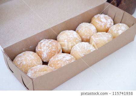 delicious snowball donuts as a background delicious snowball donuts as a background 115741938