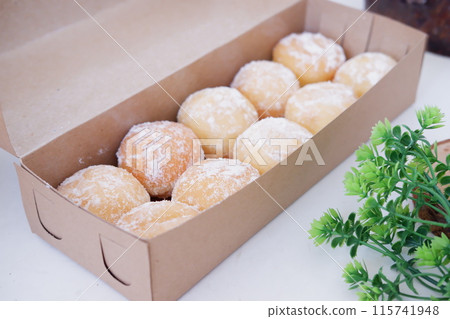 delicious snowball donuts as a background delicious snowball donuts as a background 115741948
